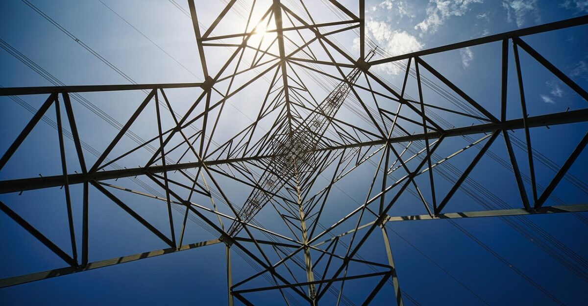 pylon electricity sun power grid infrastructure industrial landscape sky cloudscape nature perspective height scale