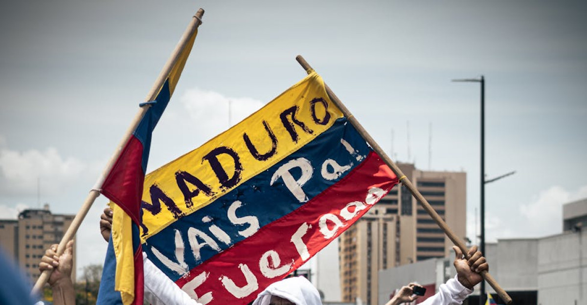 Protesters with anti-government banner in a Venezuelan street rally