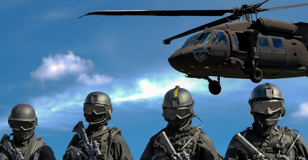 Special forces soldiers in tactical gear with helicopter overhead under a blue sky.