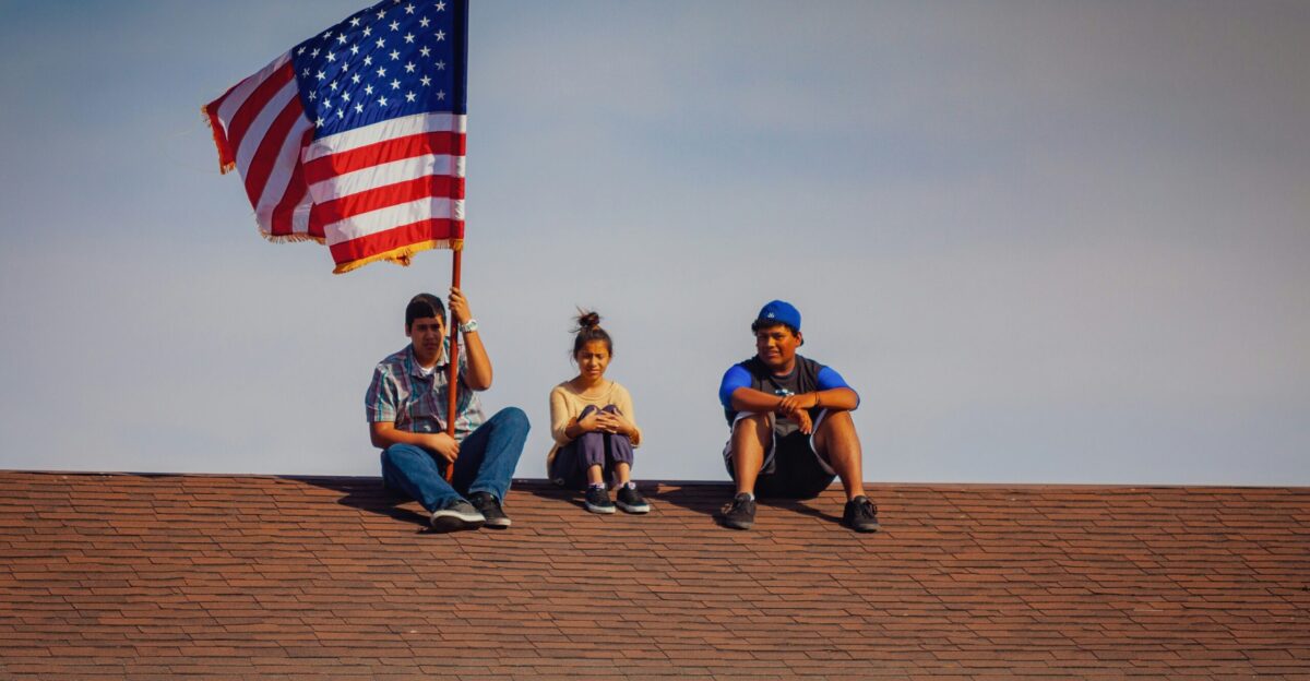 men and woman sitting on roof top