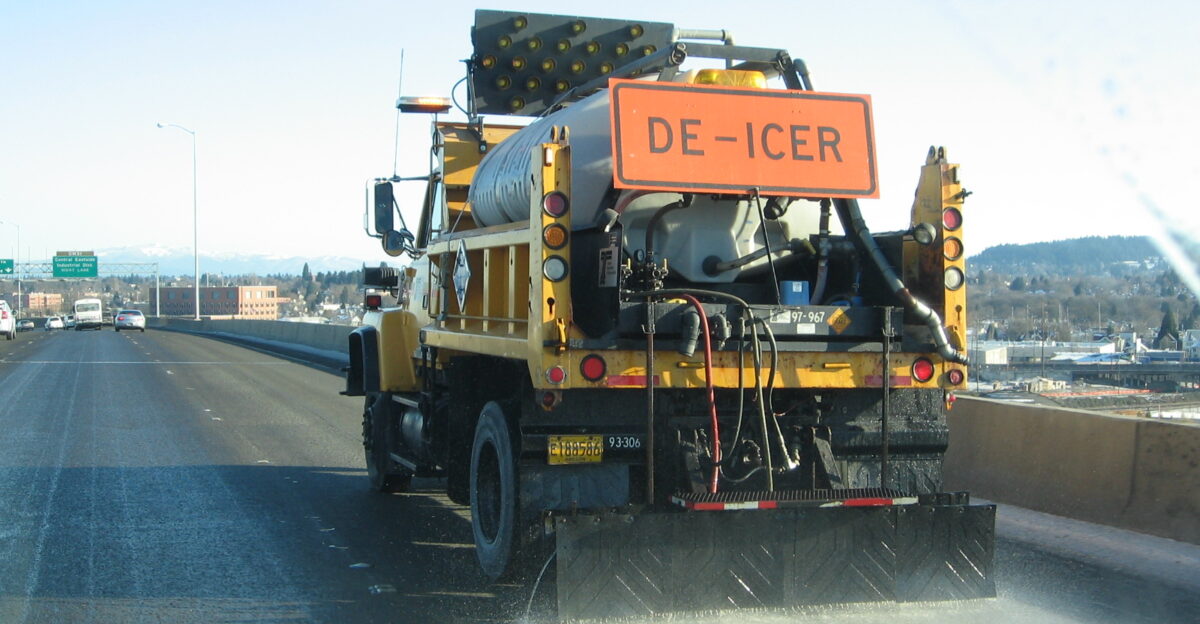 An ODOT truck applies de-icer to the I-5 Marquam Bridge