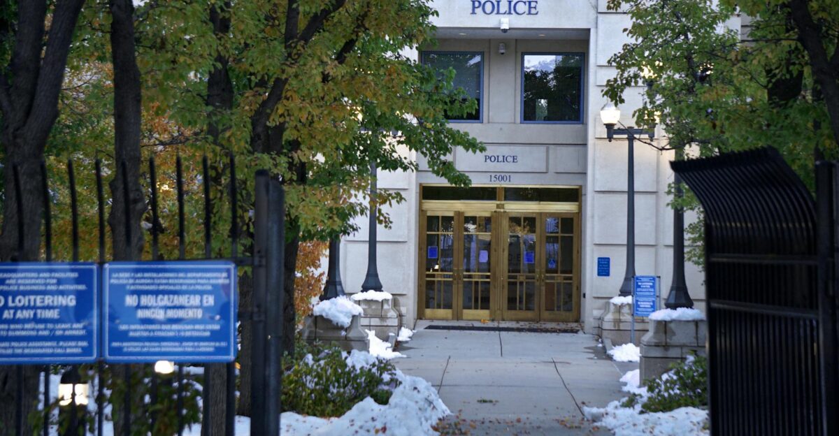 Police station entrance with snow on the ground and no loitering signs