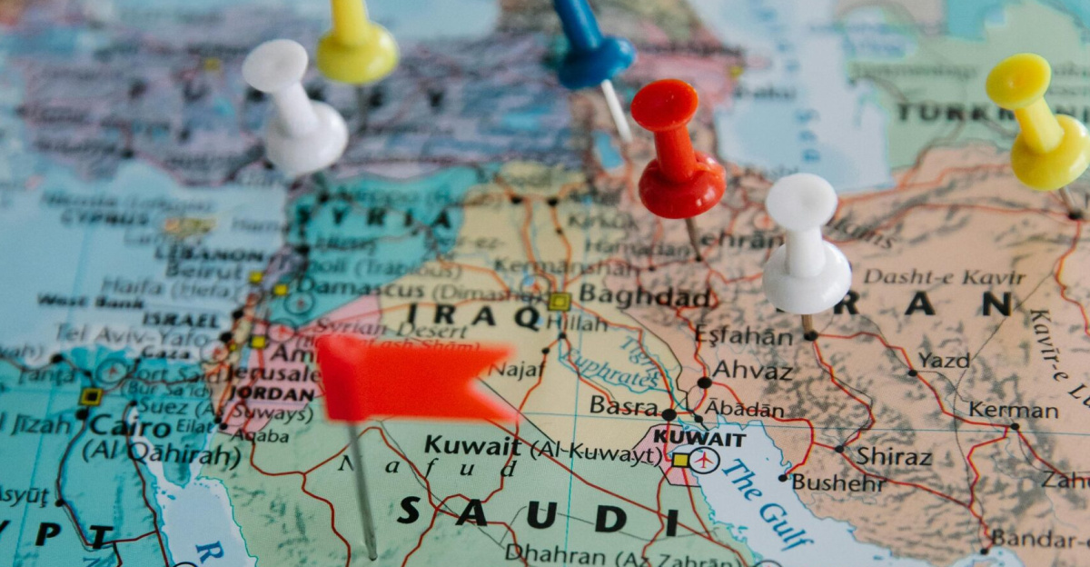 Colorful pushpins mark locations on a map of the Middle East, highlighting travel plans.
