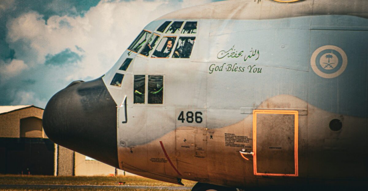 a large military plane sitting on top of an airport tarmac