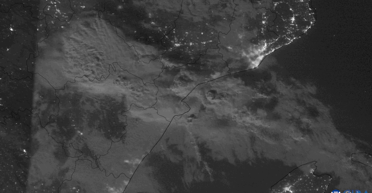 Lightning flashes within a thunderstorm moving off the eastern coast of Spain the clouds made visible at night by a full moon